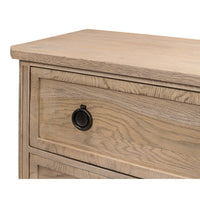 Close-up of drawer front and black knob.