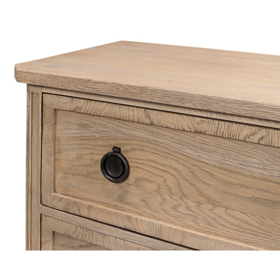 Close-up of drawer front and black knob.
