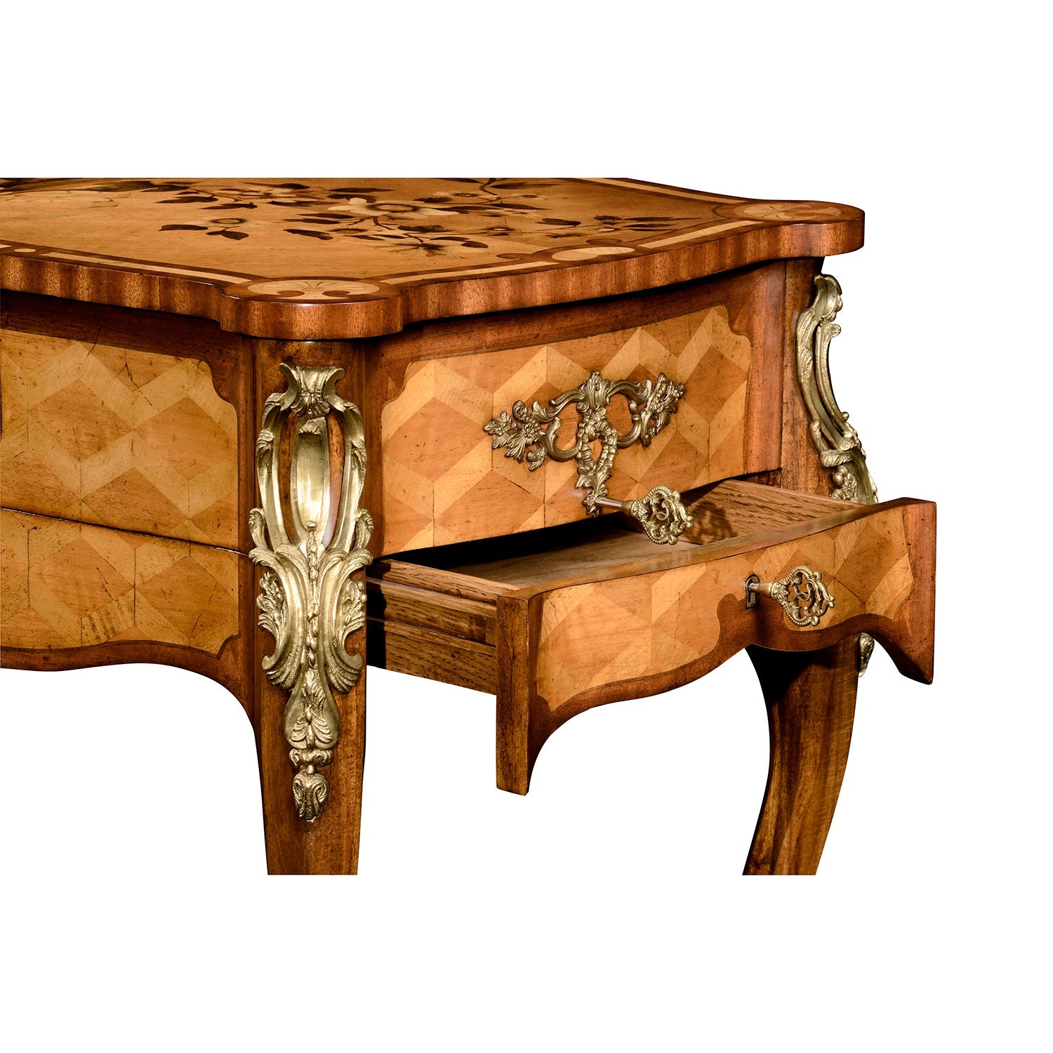 Open drawer with ornate handle on Louis XV table.
