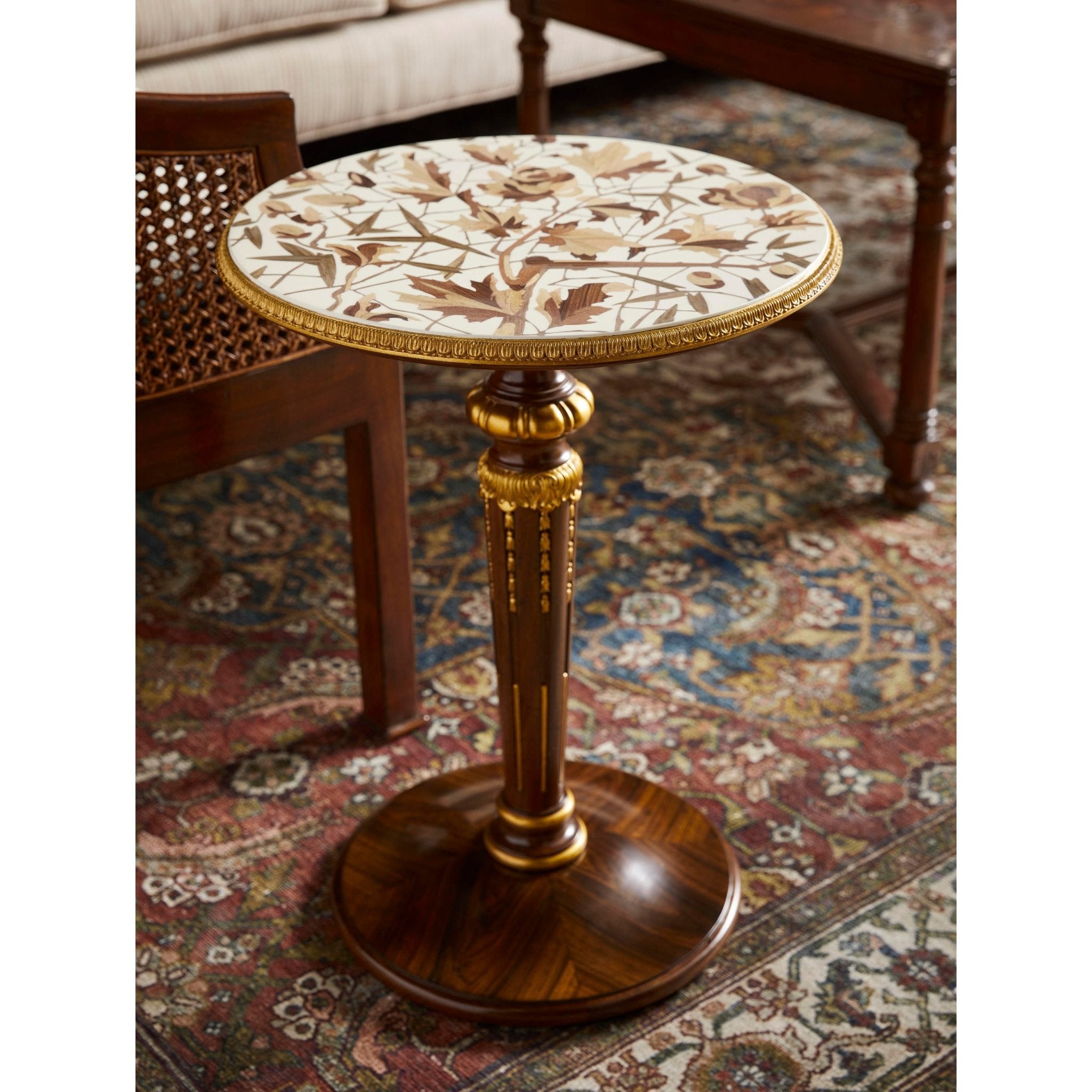 French accent table on patterned rug in living room.