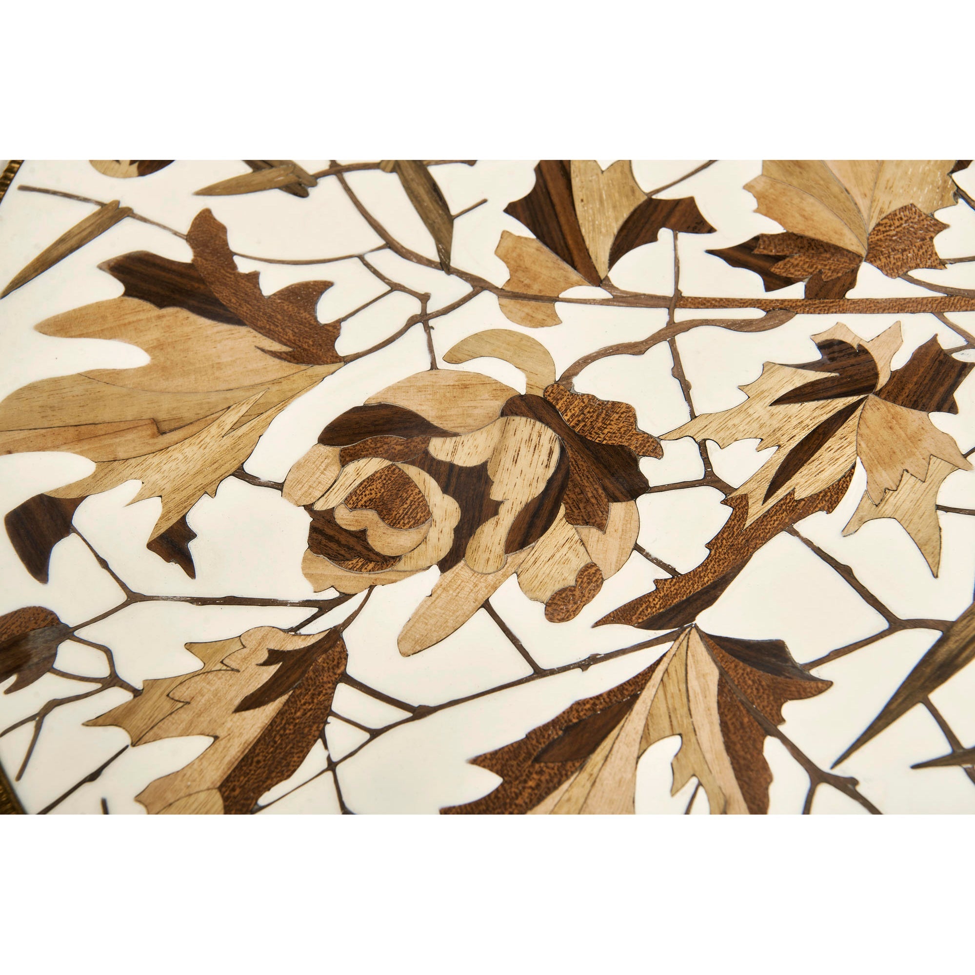 Close-up of floral pattern on accent table surface.