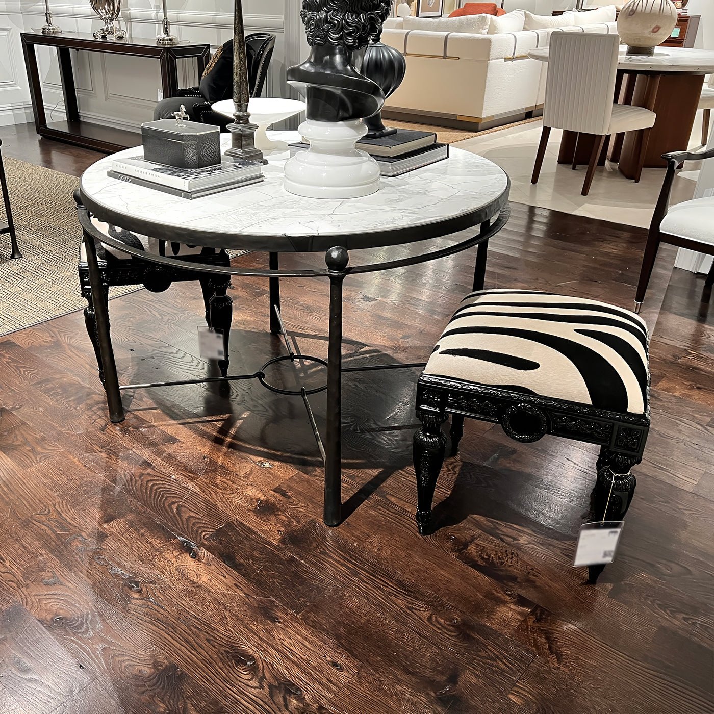 Zebra vanity stool near round table, stylish setting.