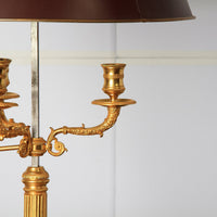 Close-up of lamp's detailed gold candle holders.