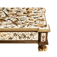 Corner view of French console table with decorative trim.
