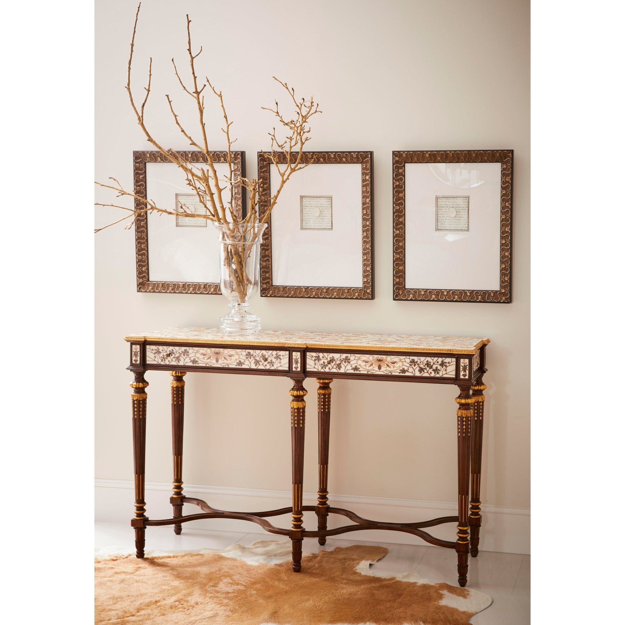 French console table styled in an elegant home setting.