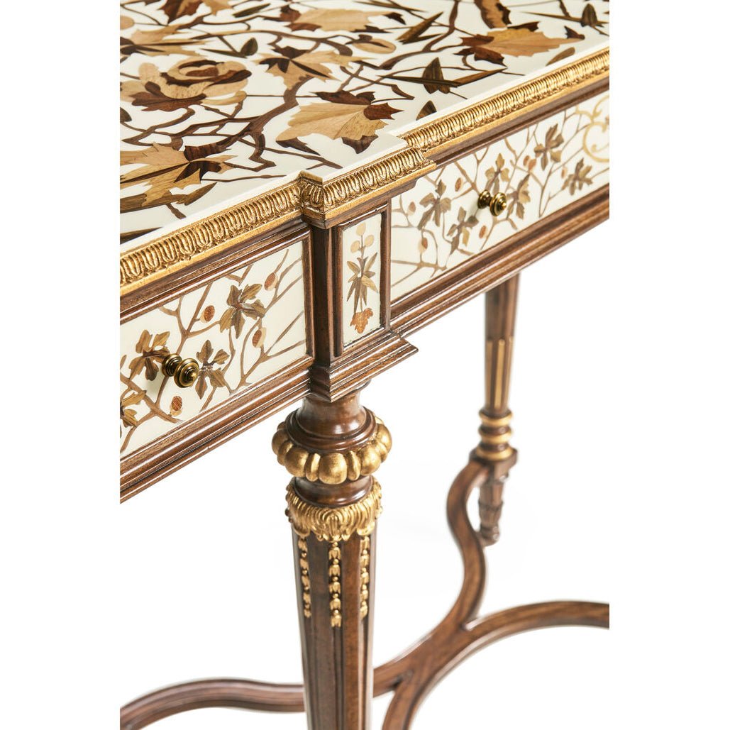 French console table leg detail with gold accents.