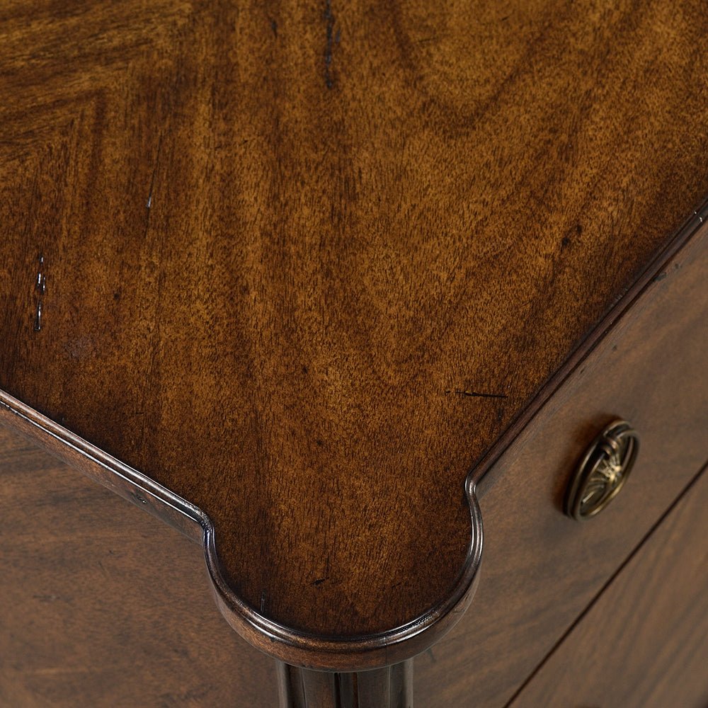 Close-up corner detail, French Louis XVI nightstand woodwork.