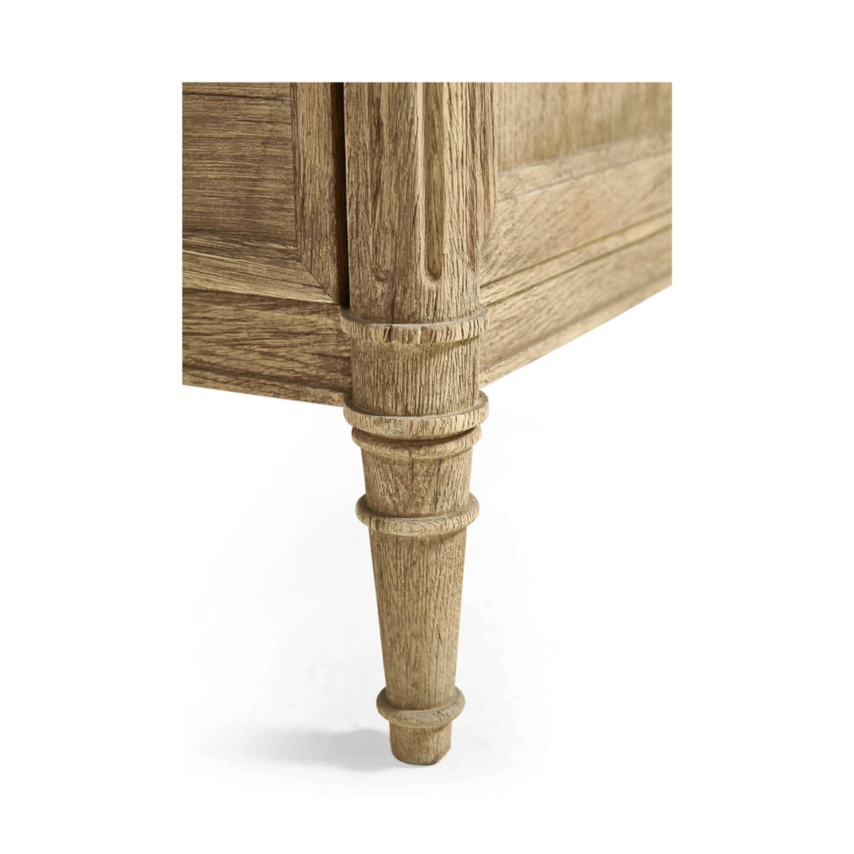 French commode leg detail, carved wood design.