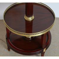 Aerial view of circular shelf with brass accents on lamp.