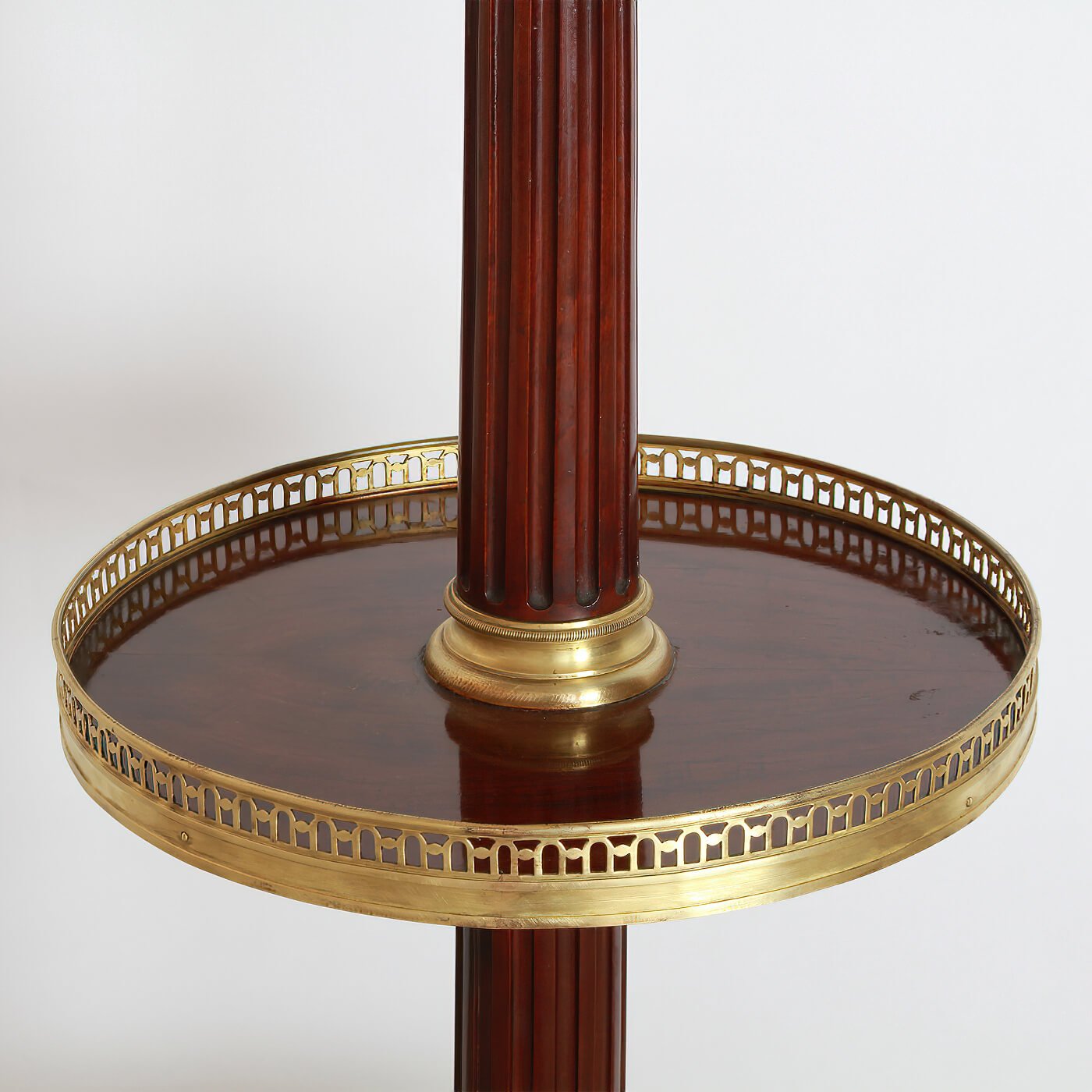 Middle shelf showcasing intricate brass detailing on lamp.