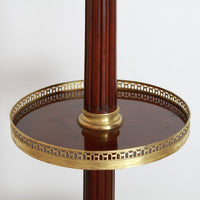 Middle shelf showcasing intricate brass detailing on lamp.