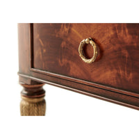 Drawer handle detail on French mahogany desk, elegant design.