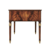 Side view of French mahogany desk with decorative legs.