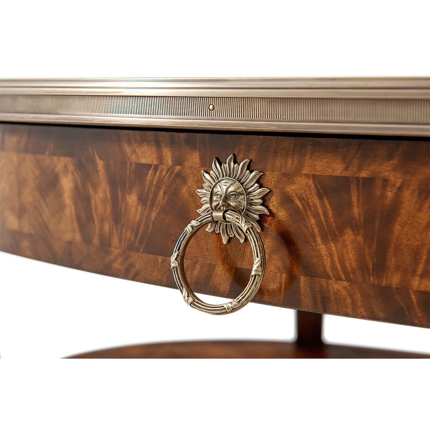 Detailed view of mahogany cocktail table's decorative sun motif.