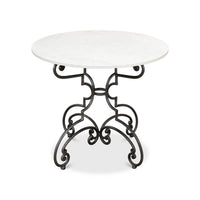 Brasserie table with marble top and curved iron legs.