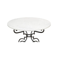 Top view of marble table showing detailed metal design.