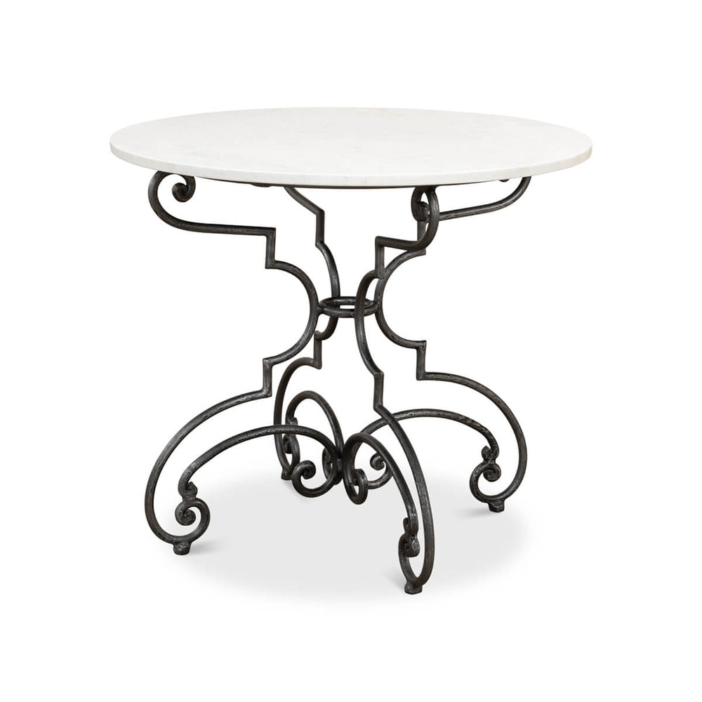 Round table with marble top and ornate metal base.