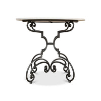 Side view of table showcasing decorative metal base design.