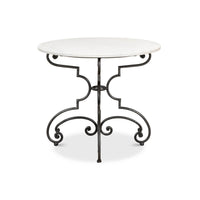 Front view of marble brasserie table with intricate legs.