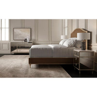 Spacious bedroom with two gold nightstands.