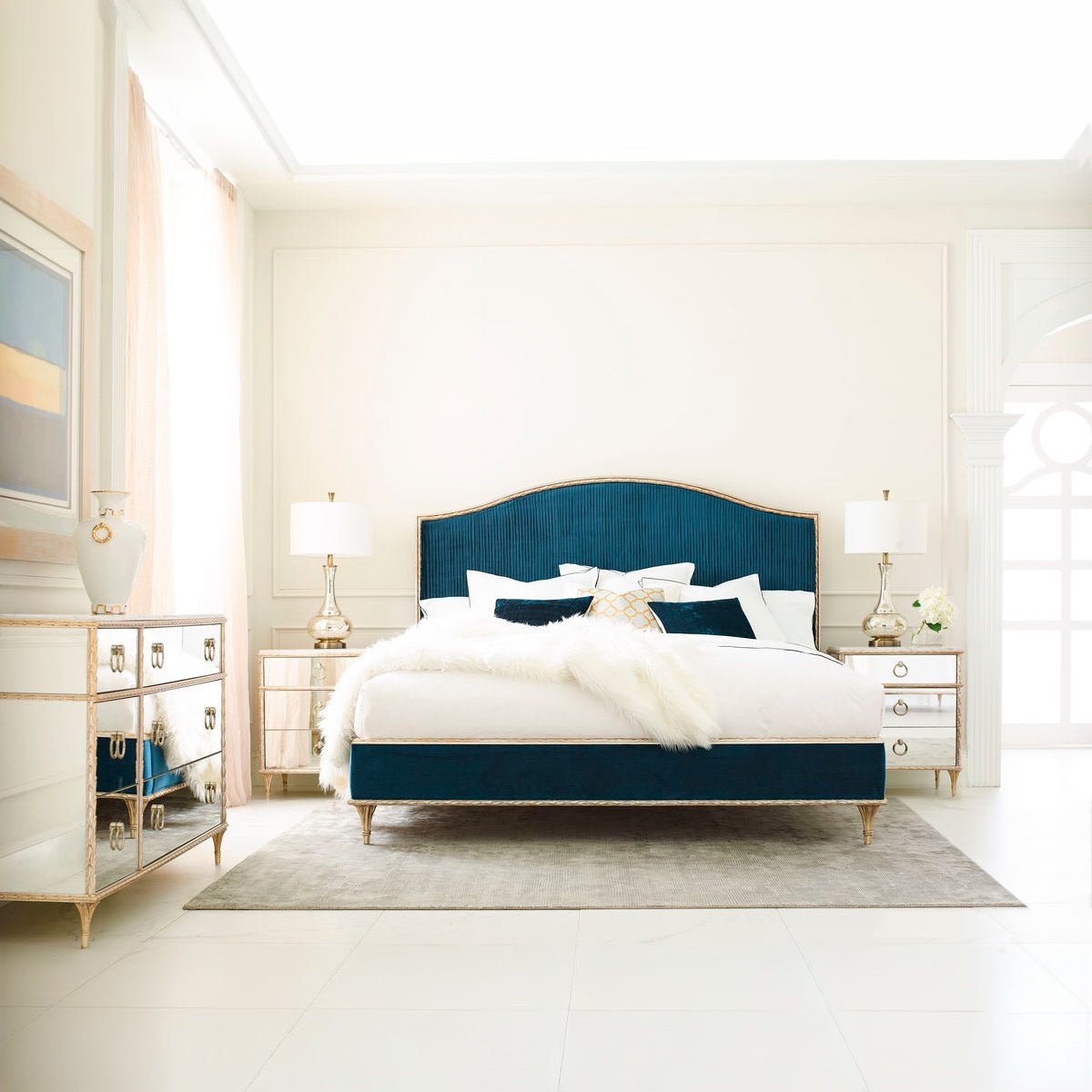Bedroom with gold nightstands and blue bed.