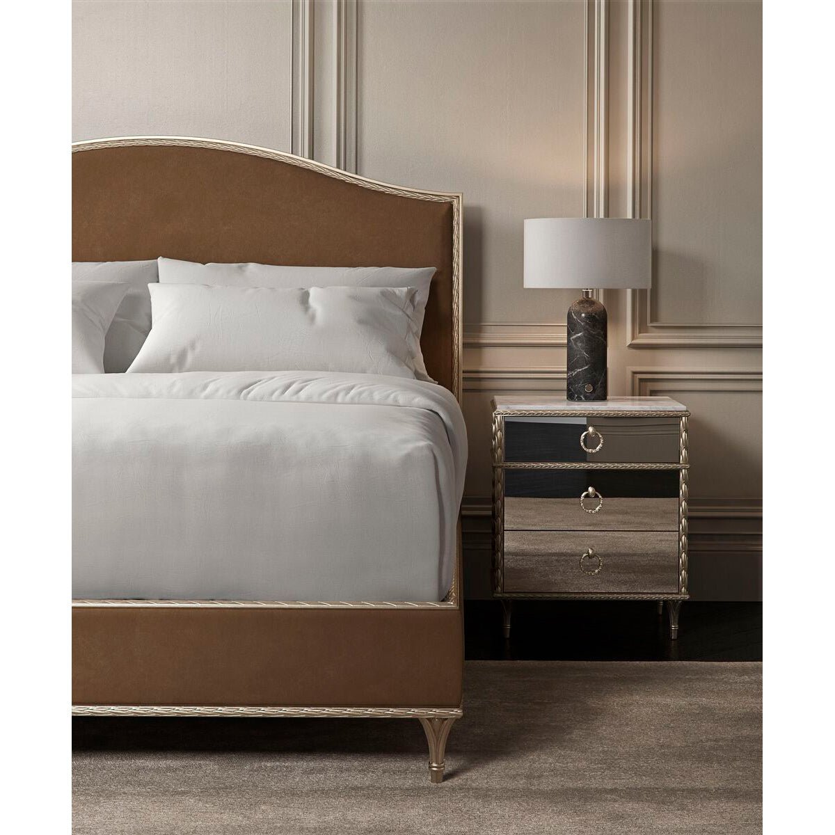 Bedroom with gold nightstand and brown bed.