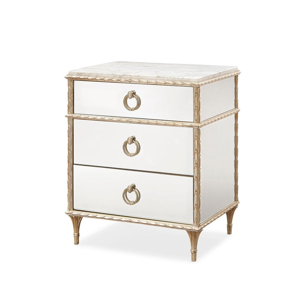 Gold French marble top nightstand angled view.