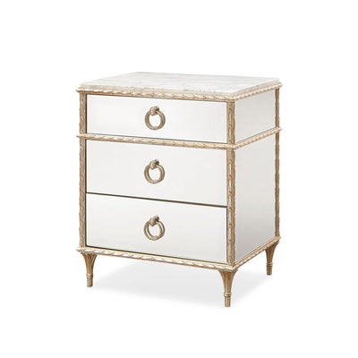 Gold French marble top nightstand angled view.