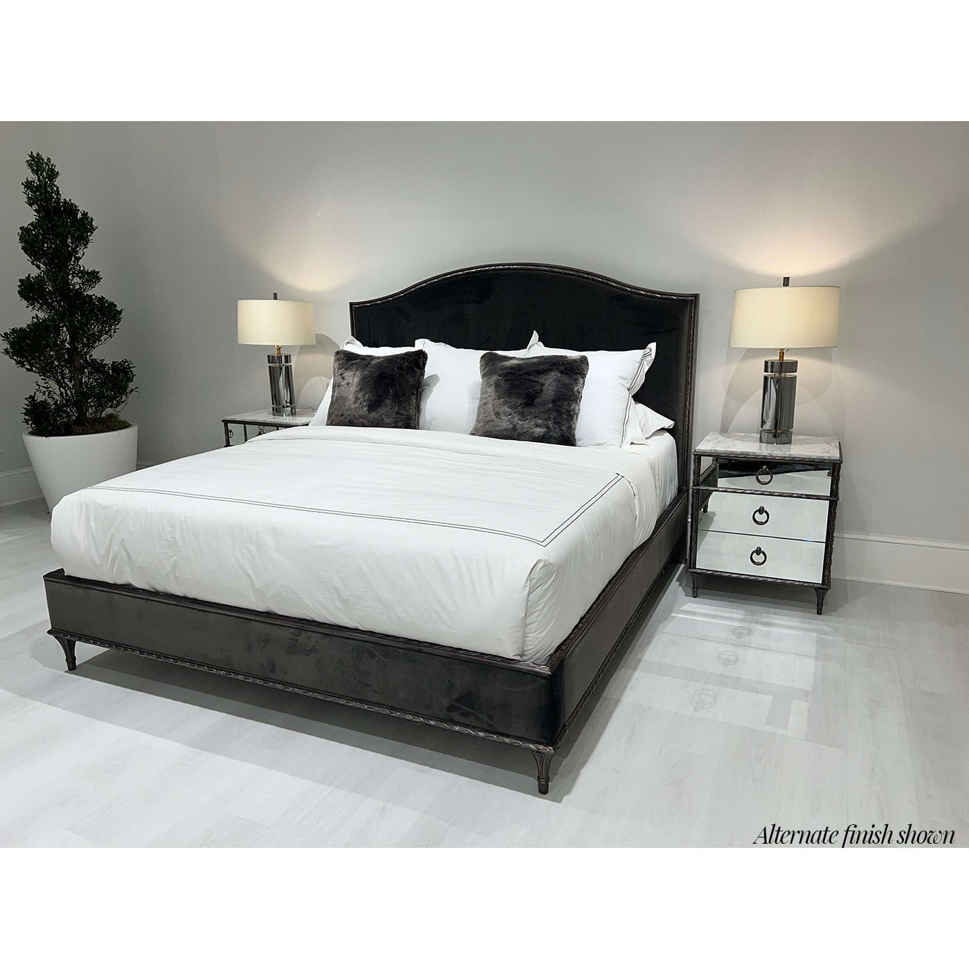 Black bed with alternate finish gold nightstands.