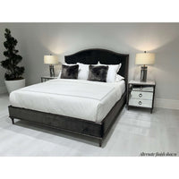 Black bed with alternate finish gold nightstands.