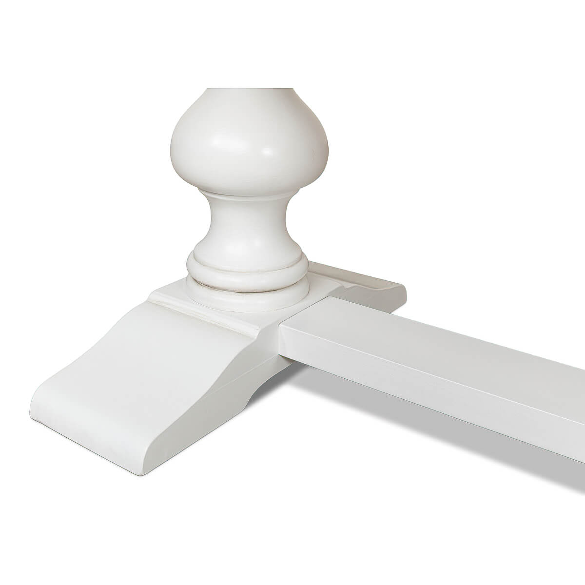 Close-up of white refectory table leg design.