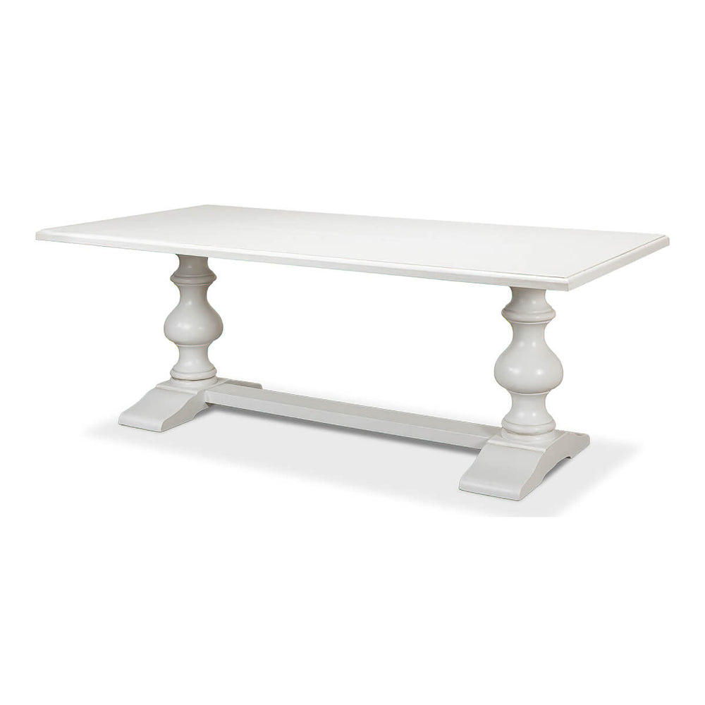 Angled view of white refectory table showing legs.