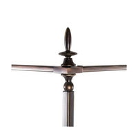 Close-up of French metal canopy bed top finial.
