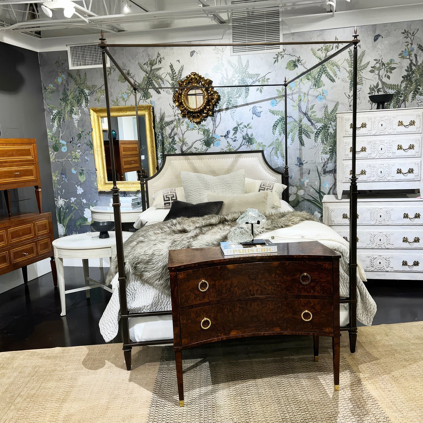 Queen metal canopy bed in eclectic, stylish bedroom setting.