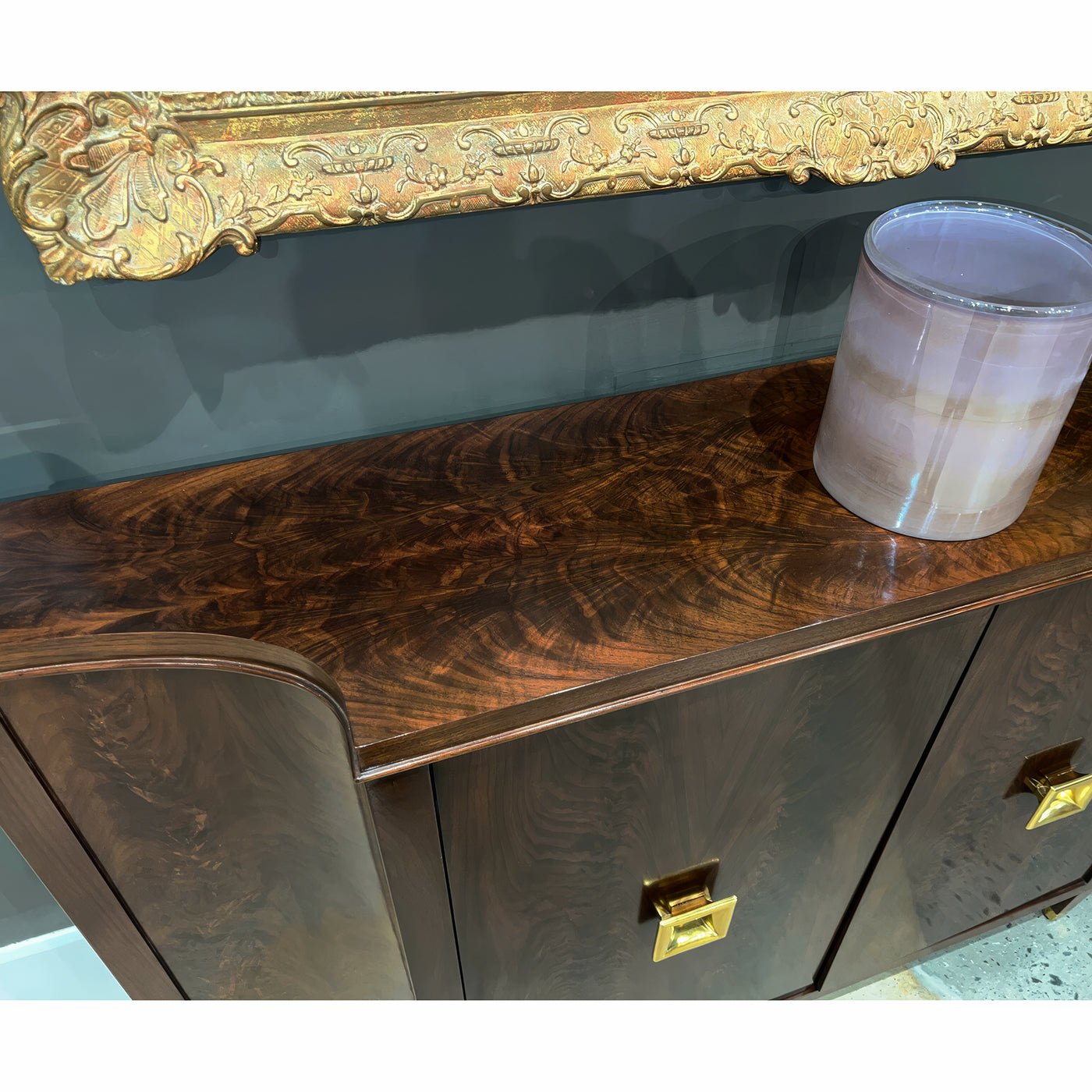 Close-up of wooden top on French sideboard.