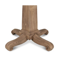 Detailed view of pedestal base with curved legs.