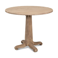 Round wooden bistro table with pedestal base, side view.