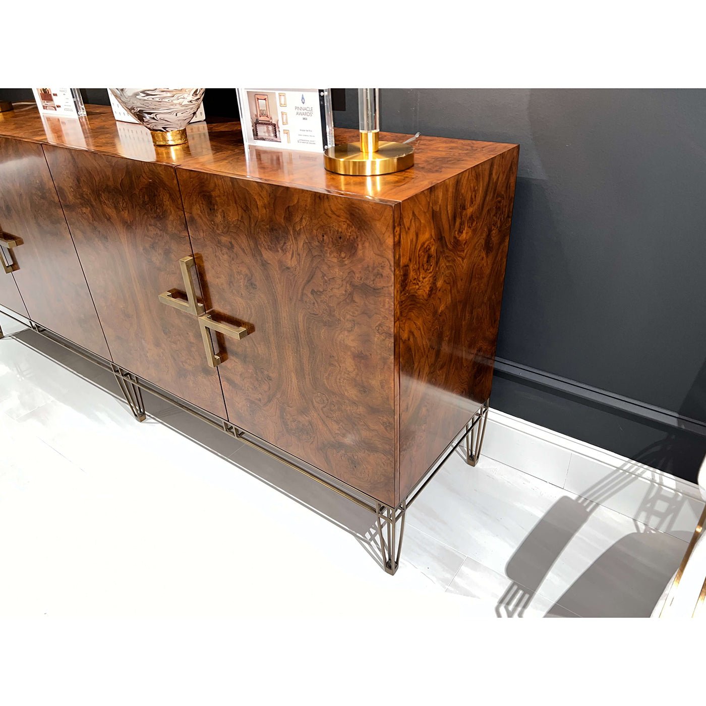 Angled view of sideboard showcasing glossy finish.