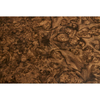 Detailed view of burl wood pattern on end table.