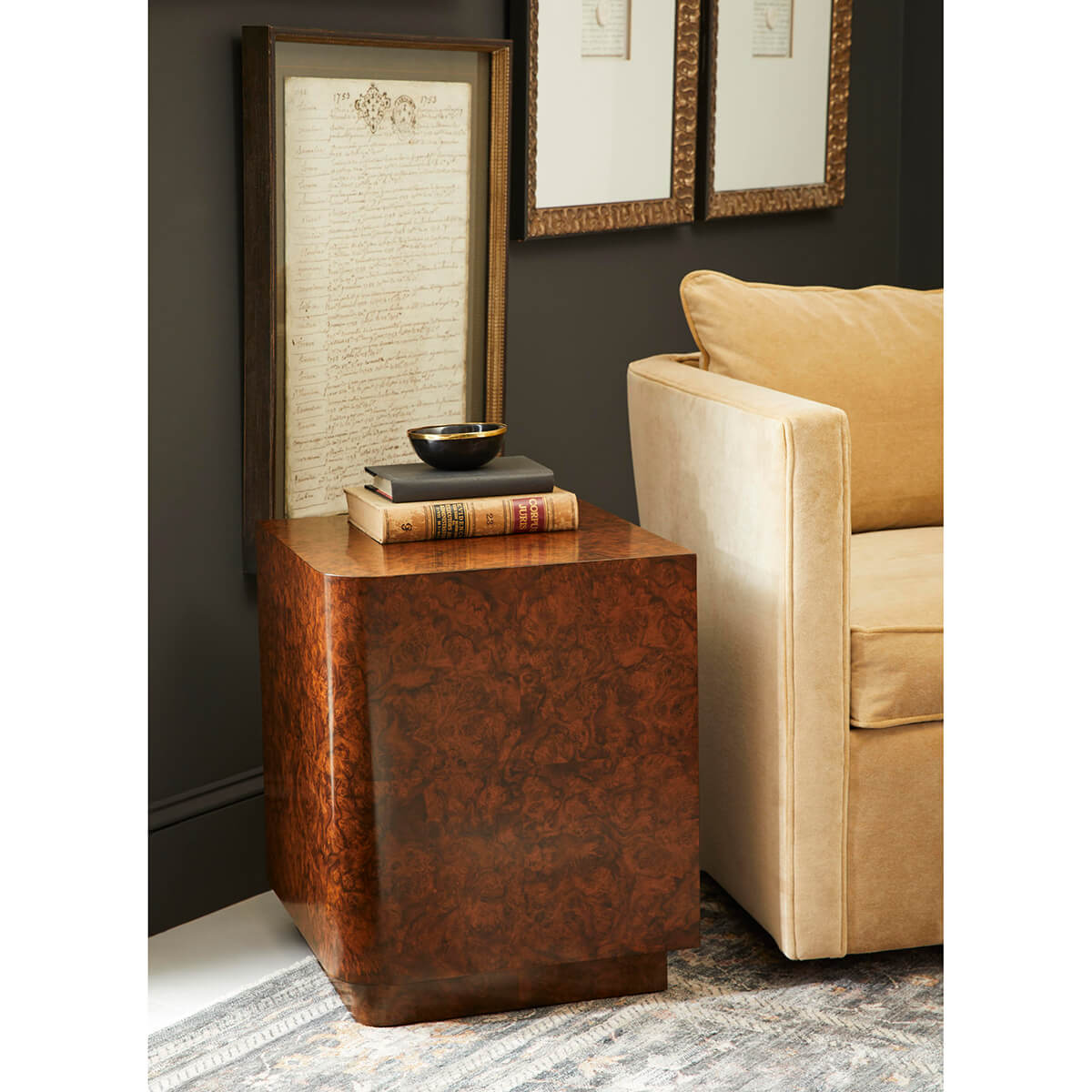 Burl wood end table in living room, decorative setup.