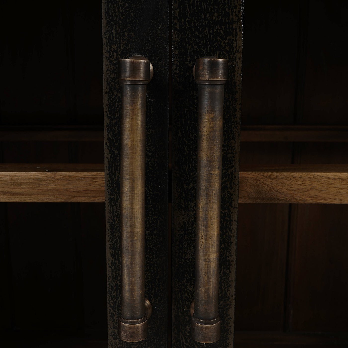 Detailed view of sideboard handles and wood texture.