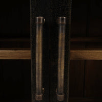 Detailed view of sideboard handles and wood texture.