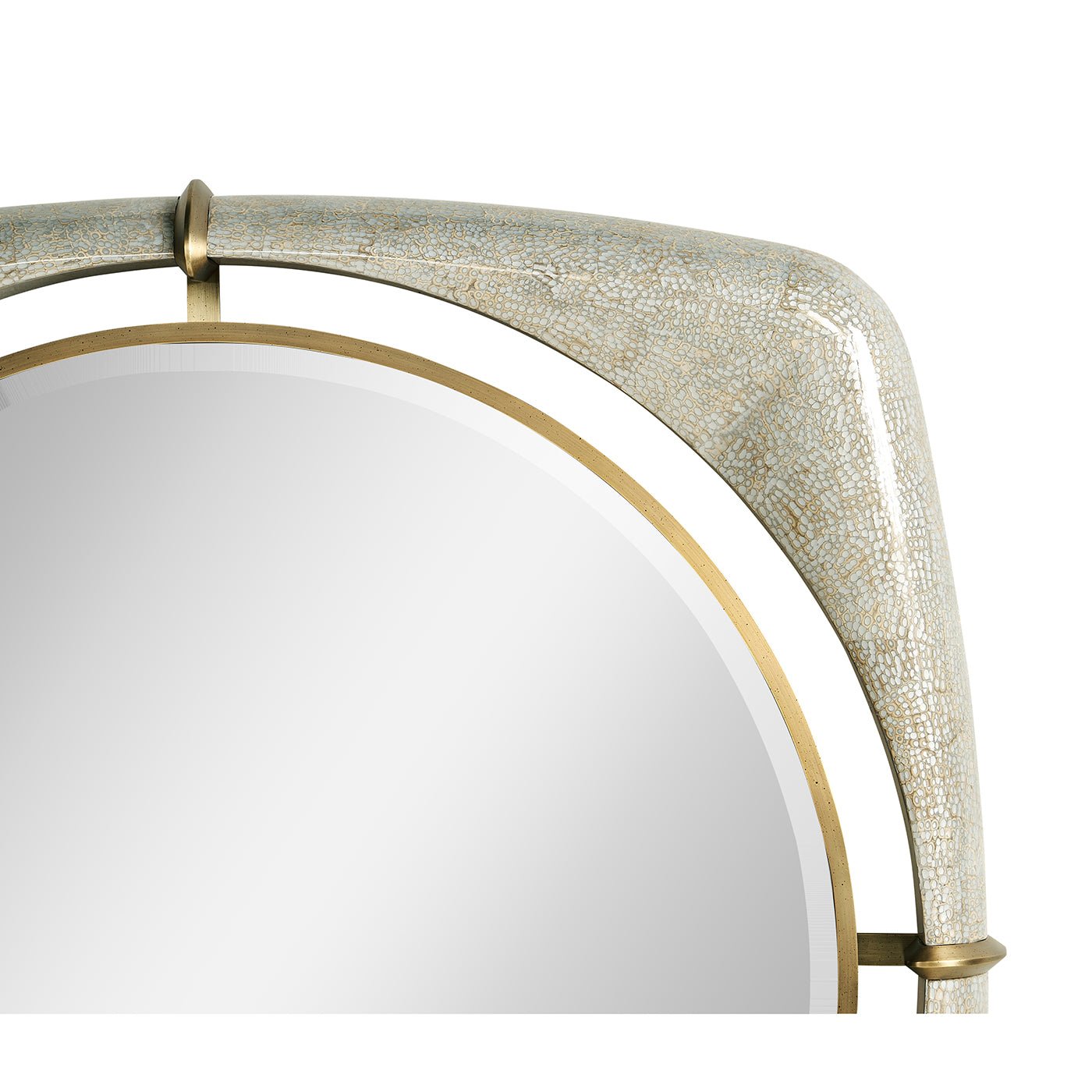 Close-up of mirror's top corner with gold elements.