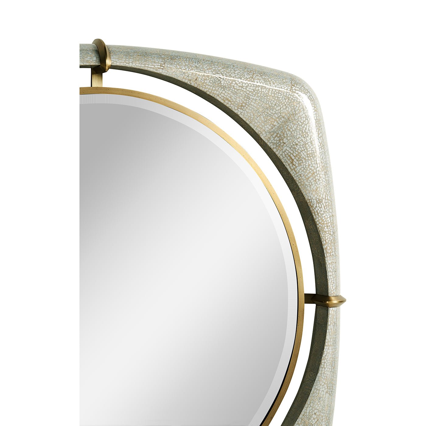 Side view of mirror's curved frame with gold trim.
