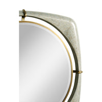 Side view of mirror's curved frame with gold trim.