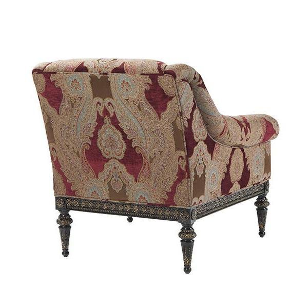 Red floral patterned armchair, back view.