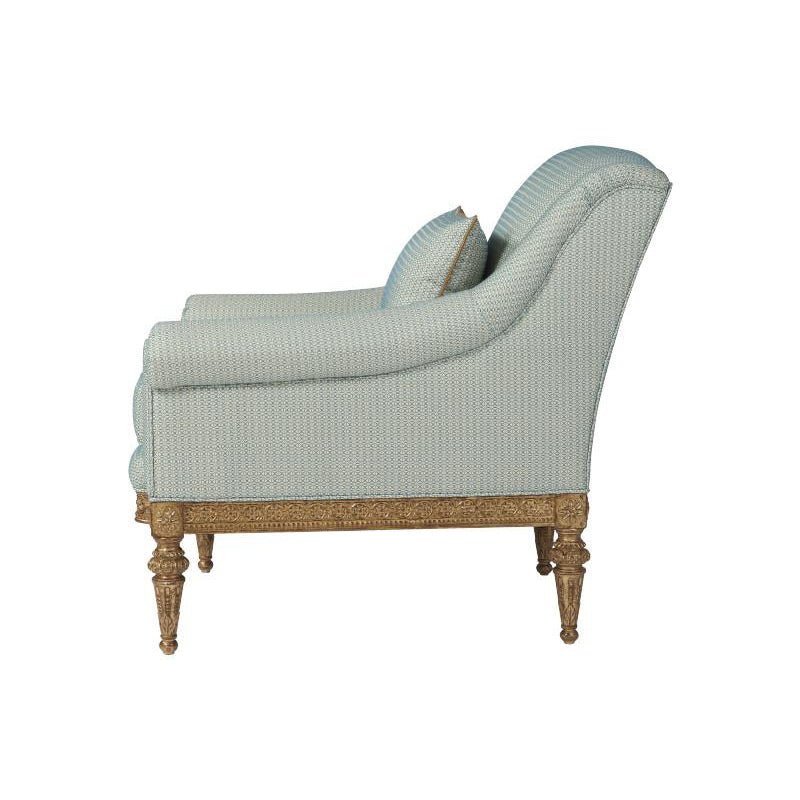 Light blue fabric armchair, side view.