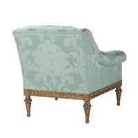 Patterned light green armchair, back view.