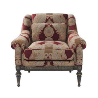Red floral patterned armchair, front view.