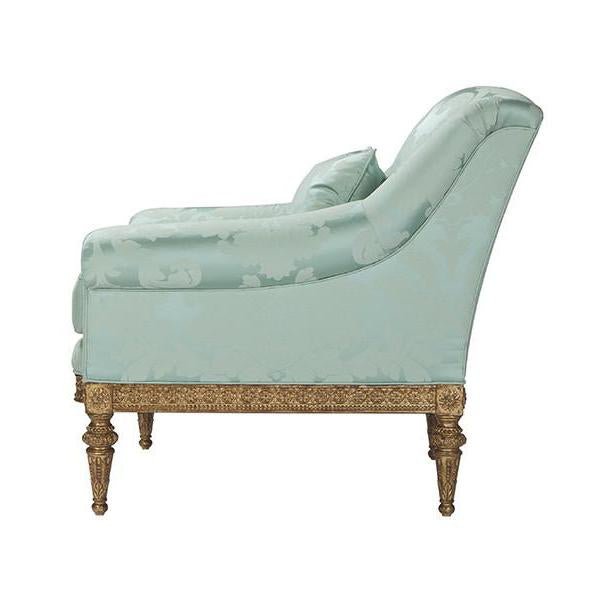 Patterned light green armchair, side view.